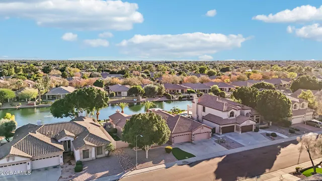 an aerial view of a house with lake view