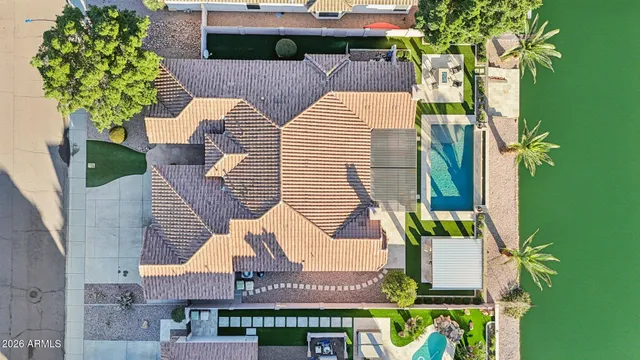 an aerial view of a house with garden space and street view