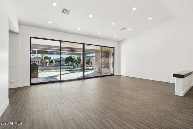 a kitchen with stainless steel appliances a sink stove and cabinets