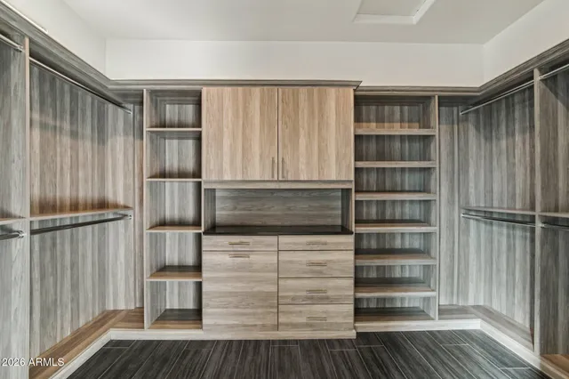a bathroom with a shower and a mirror
