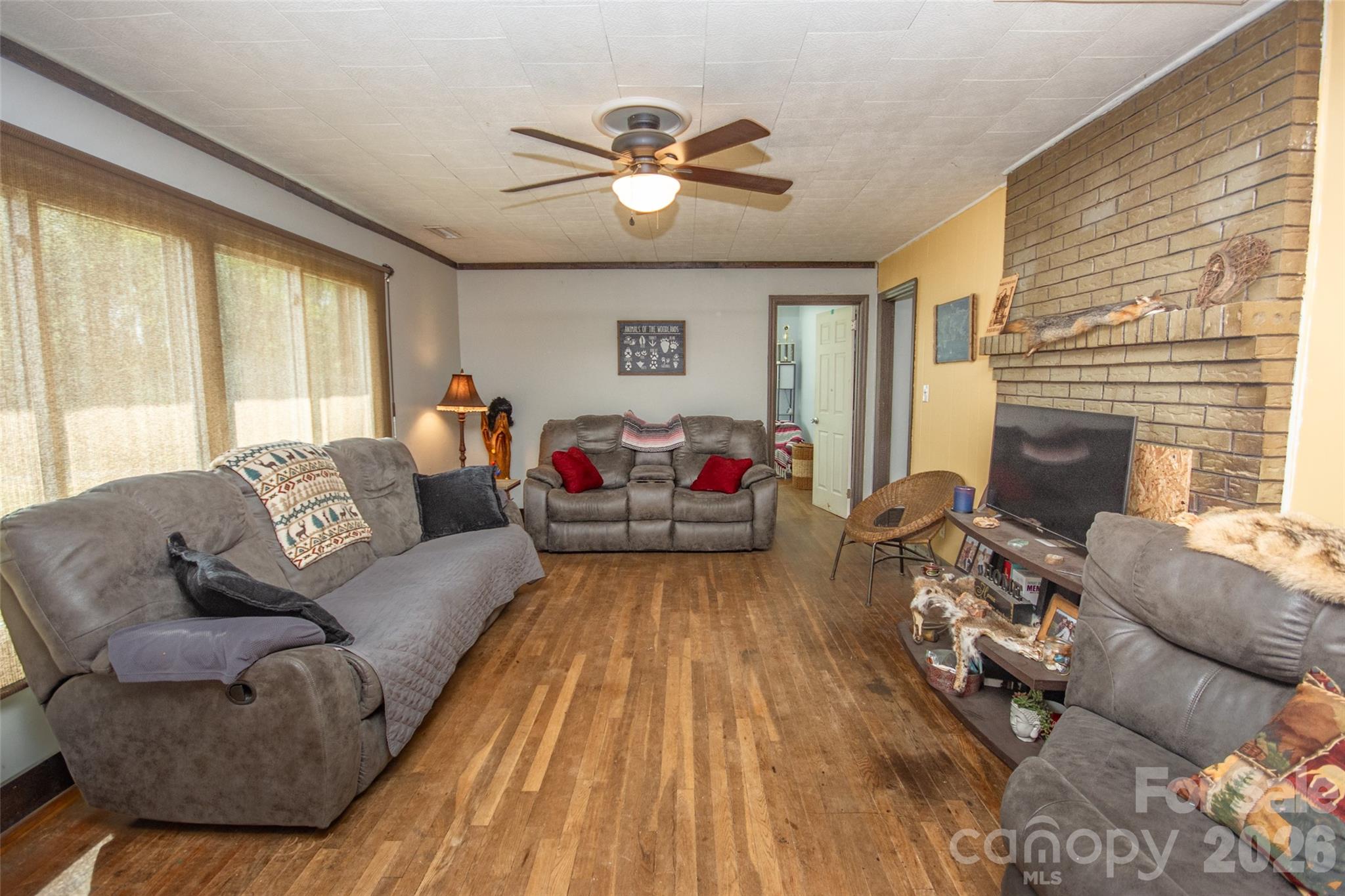 120 Mitch Road Union Grove, NC 28689 - Photo 12 of 24 a living room with furniture and a fireplace