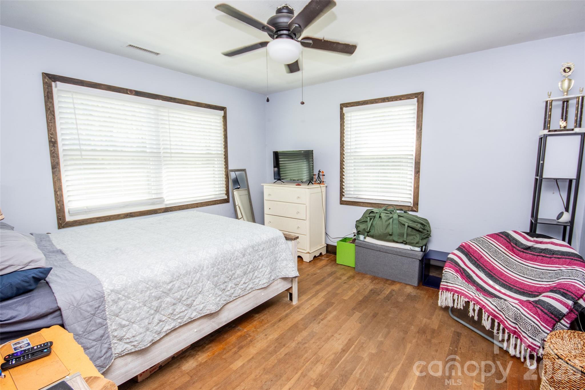120 Mitch Road Union Grove, NC 28689 - Photo 14 of 24 a bedroom with a bed and a chandelier
