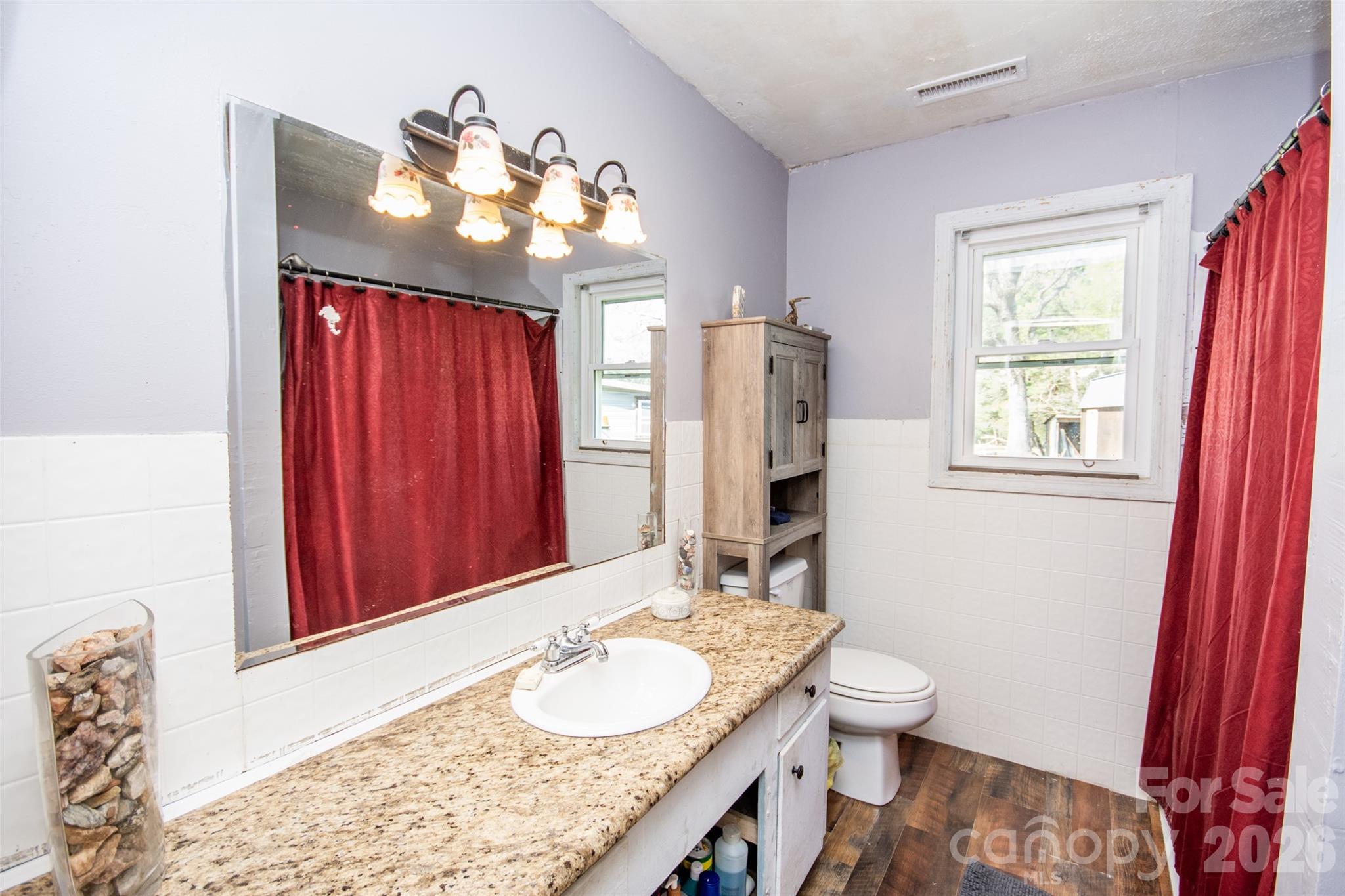 120 Mitch Road Union Grove, NC 28689 - Photo 16 of 24 a bathroom with a granite countertop sink and a mirror