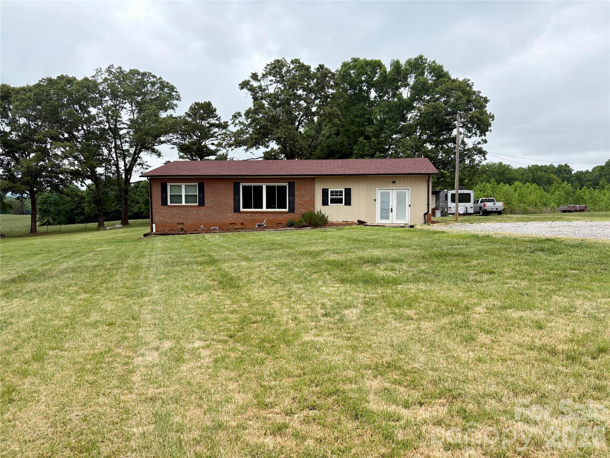120 Mitch Road Union Grove, NC 28689 - Photo 2 of 24 a house that has a big yard with large trees