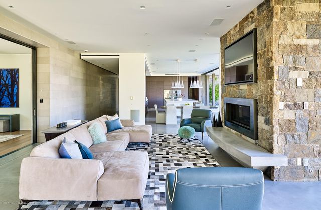 a living room with furniture fireplace and a flat screen tv