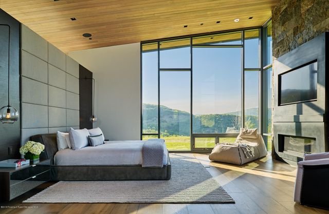 a view of living room with furniture and floor to ceiling window