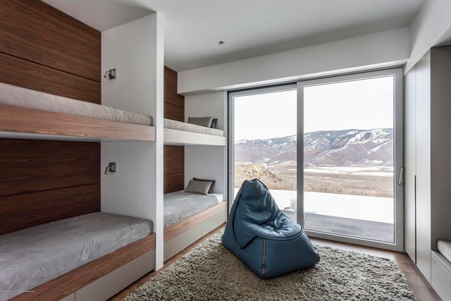 a living room with a couch and a wall painting