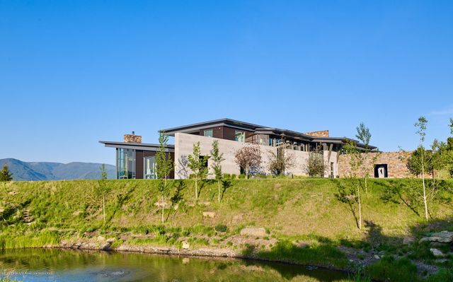 a blue swimming pool is in a middle of the house