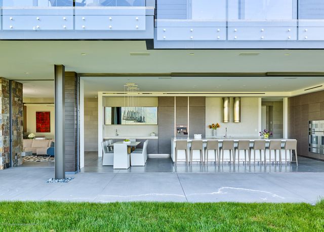 a view of a house with backyard and porch