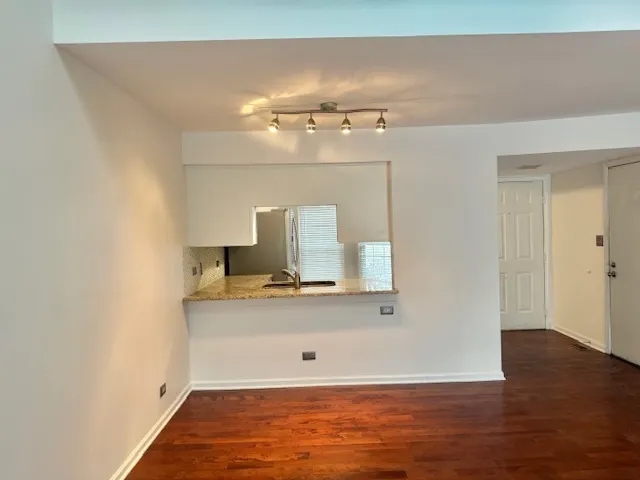 a view of a bathroom with sink and mirror