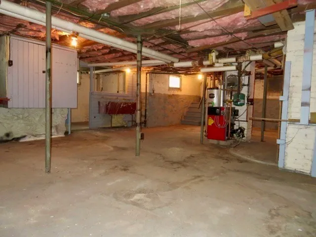a view of a room with water heater and storage