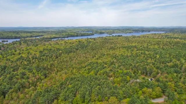 a view of a field with an ocean view