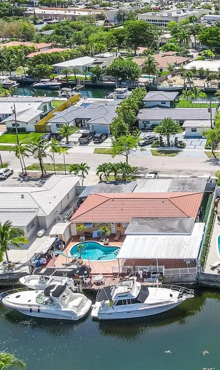 12941 Auralia Road North Miami, FL 33181 - Photo 1 of 32 an aerial view of residential houses with outdoor space