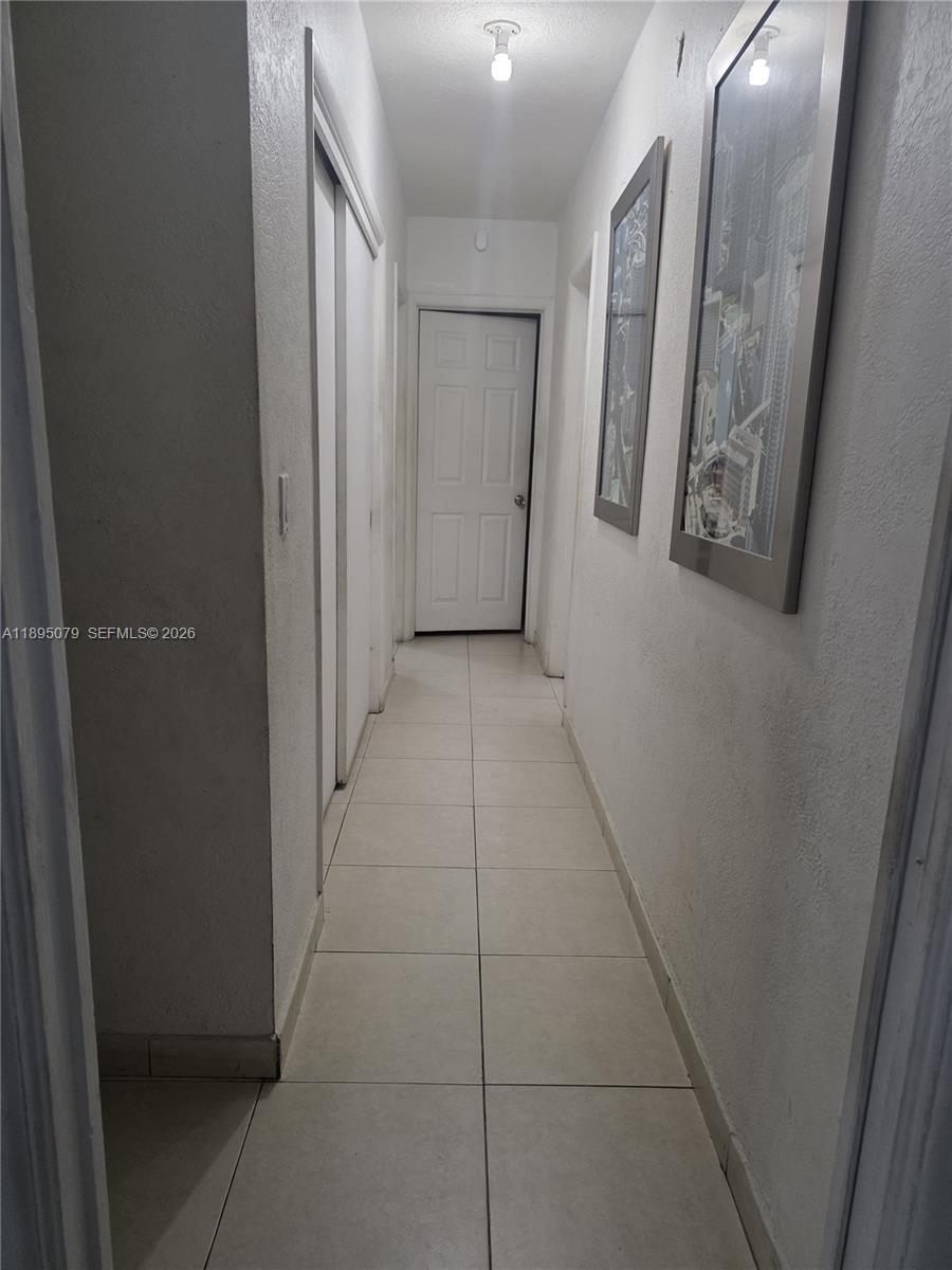 12941 Auralia Road North Miami, FL 33181 - Photo 13 of 32 a view of a hallway