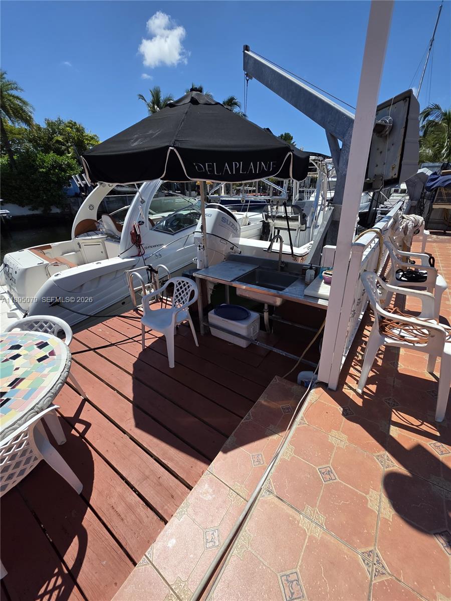 12941 Auralia Road North Miami, FL 33181 - Photo 32 of 32 a view of a terrace with furniture