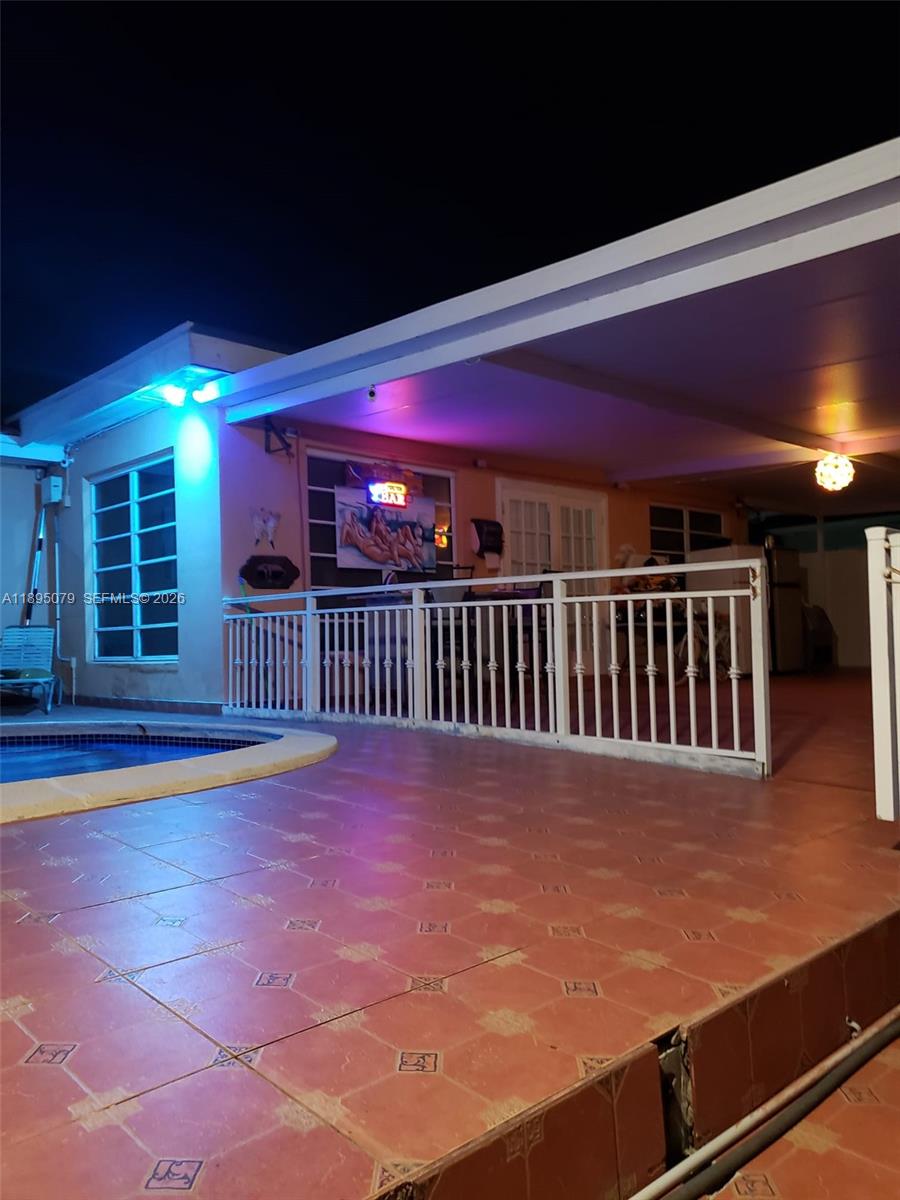 12941 Auralia Road North Miami, FL 33181 - Photo 7 of 32 a view of a balcony with a chair