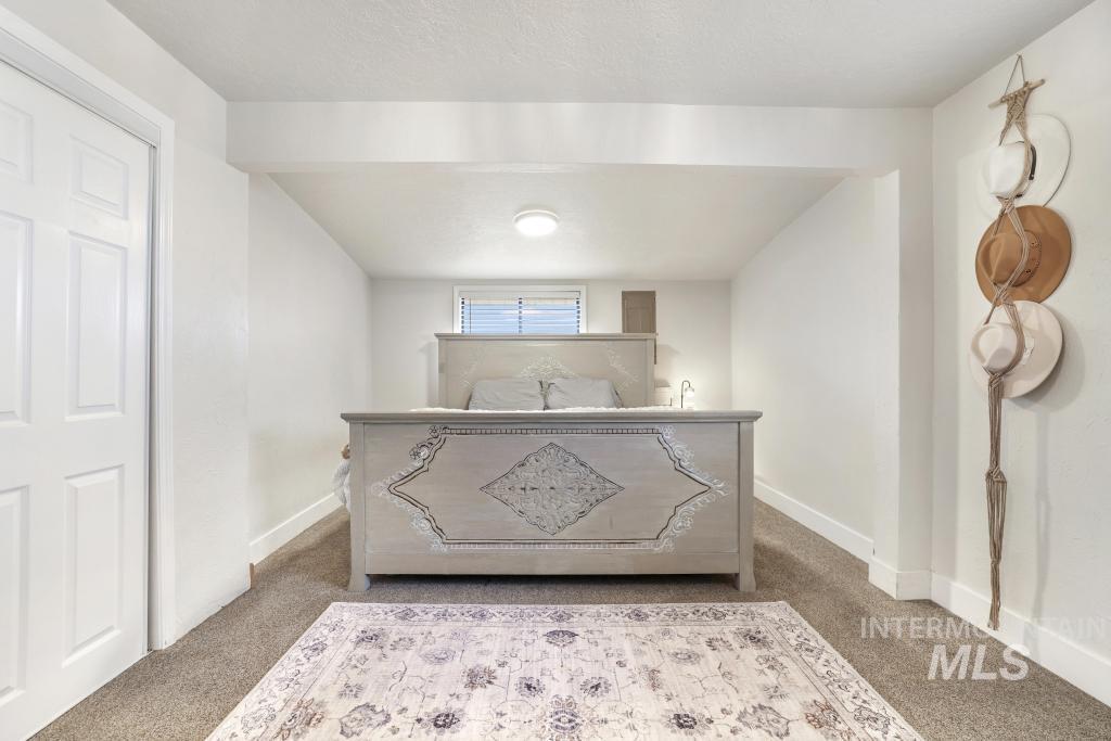 2243 4000 North Filer, ID 83328 - Photo 8 of 30 Bedroom with baseboards and light carpet