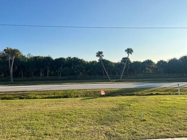 a view of a patio with a table and chairs