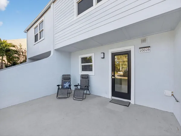 a kitchen with a stove a sink and a refrigerator