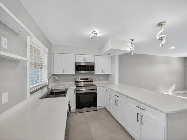 a bathroom with a sink and mirror