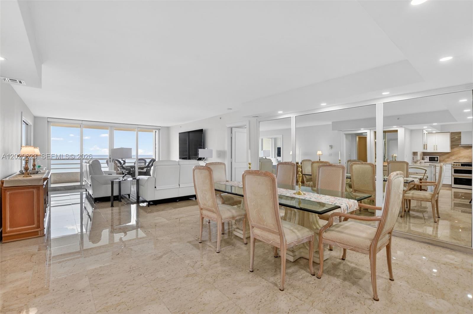 4101 North Ocean Boulevard, Unit 1605 Boca Raton, FL 33431 - Photo 8 of 35 a view of a livingroom with furniture and a kitchen