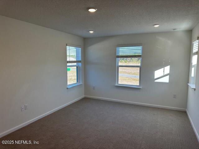 156 Camphor Laurel Road St. Augustine, FL 32092 - Photo 20 of 34 an empty room with windows