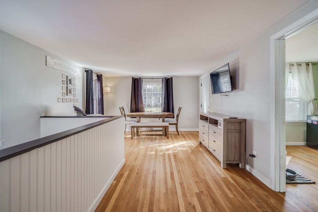 76 Wilshire Road Springfield, MA 01118 - Photo 11 of 34 a living room with furniture and a wooden floor