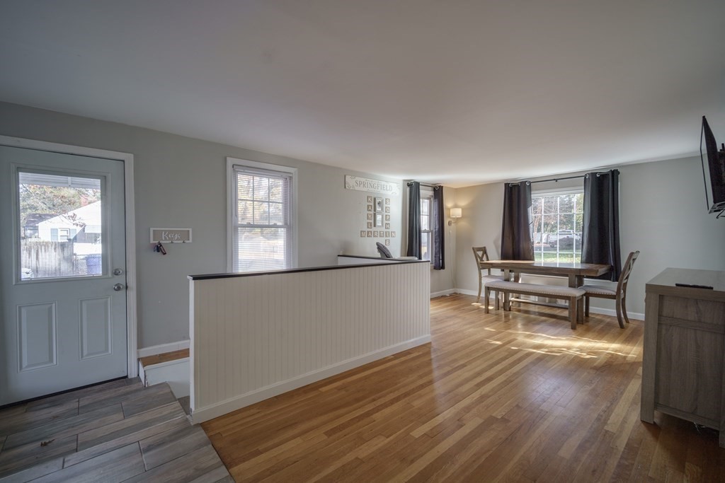 76 Wilshire Road Springfield, MA 01118 - Photo 12 of 34 a view of empty room with wooden floor and furniture