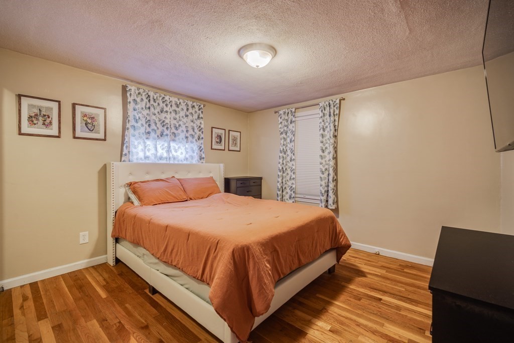 76 Wilshire Road Springfield, MA 01118 - Photo 13 of 34 a bedroom with a bed and a window