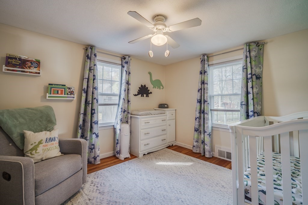 76 Wilshire Road Springfield, MA 01118 - Photo 15 of 34 a view of a livingroom with furniture and a ceiling fan
