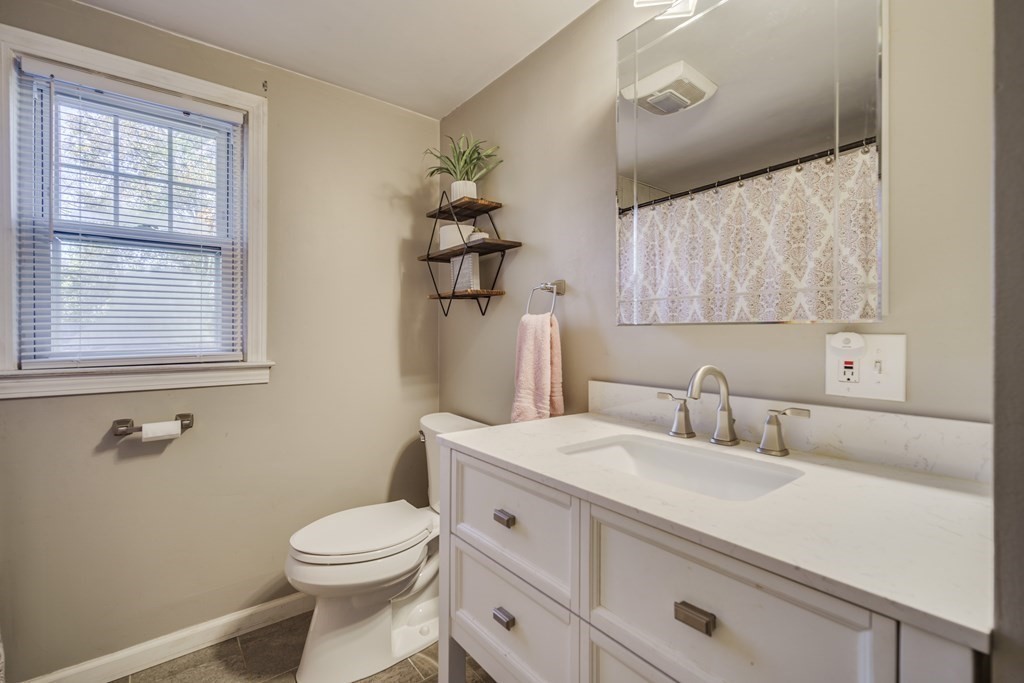 76 Wilshire Road Springfield, MA 01118 - Photo 20 of 34 a bathroom with a sink a toilet and mirror