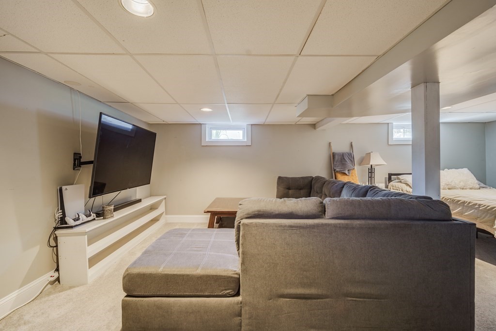 76 Wilshire Road Springfield, MA 01118 - Photo 23 of 34 a living room with furniture and a flat screen tv