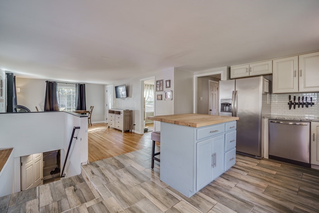 76 Wilshire Road Springfield, MA 01118 - Photo 10 of 34 a kitchen with cabinets and wooden floor