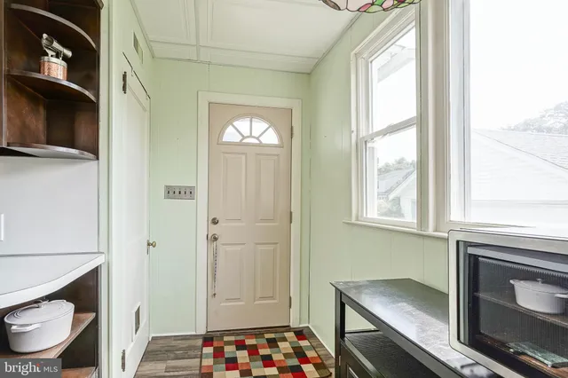 a bathroom with a sink a toilet and a window