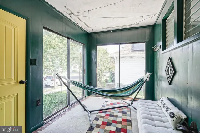 a room with furniture and a large window