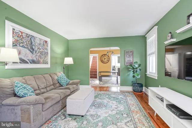 a living room with furniture and a rug