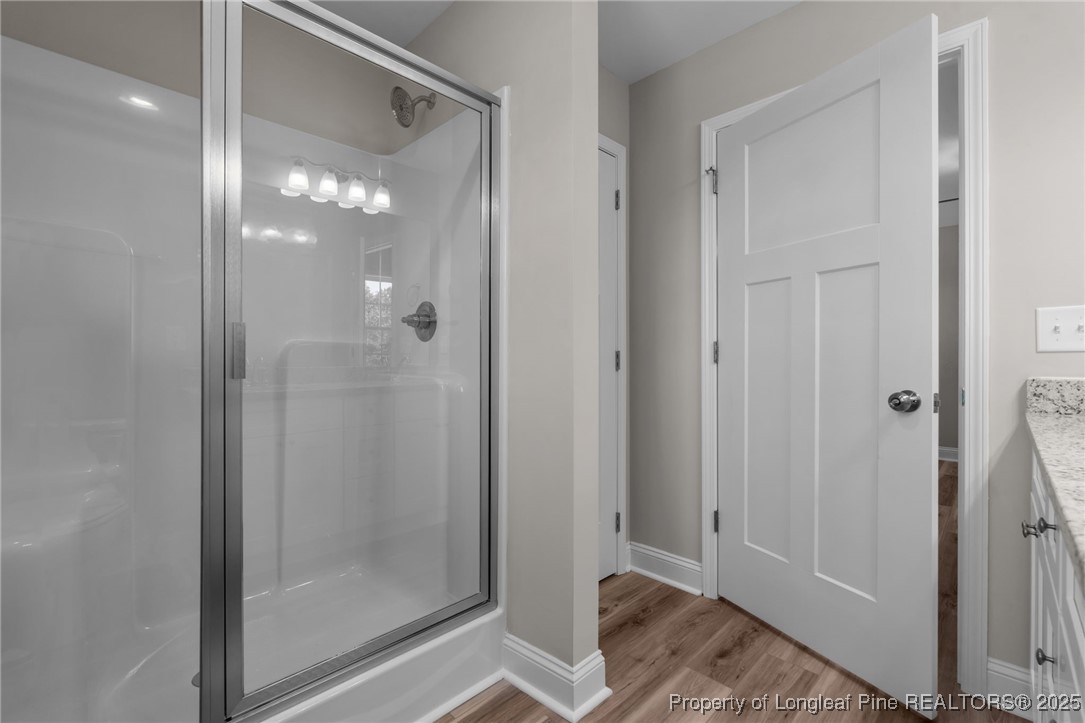 115 Gilchrist Road Carthage, NC 28327 - Photo 33 of 42 a bathroom with a glass shower door