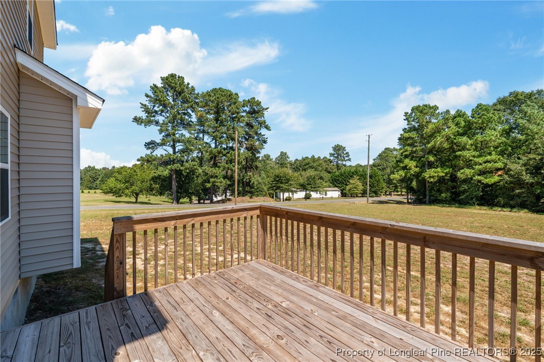 115 Gilchrist Road Carthage, NC 28327 - Photo 36 of 42 a balcony with wooden floor and fence