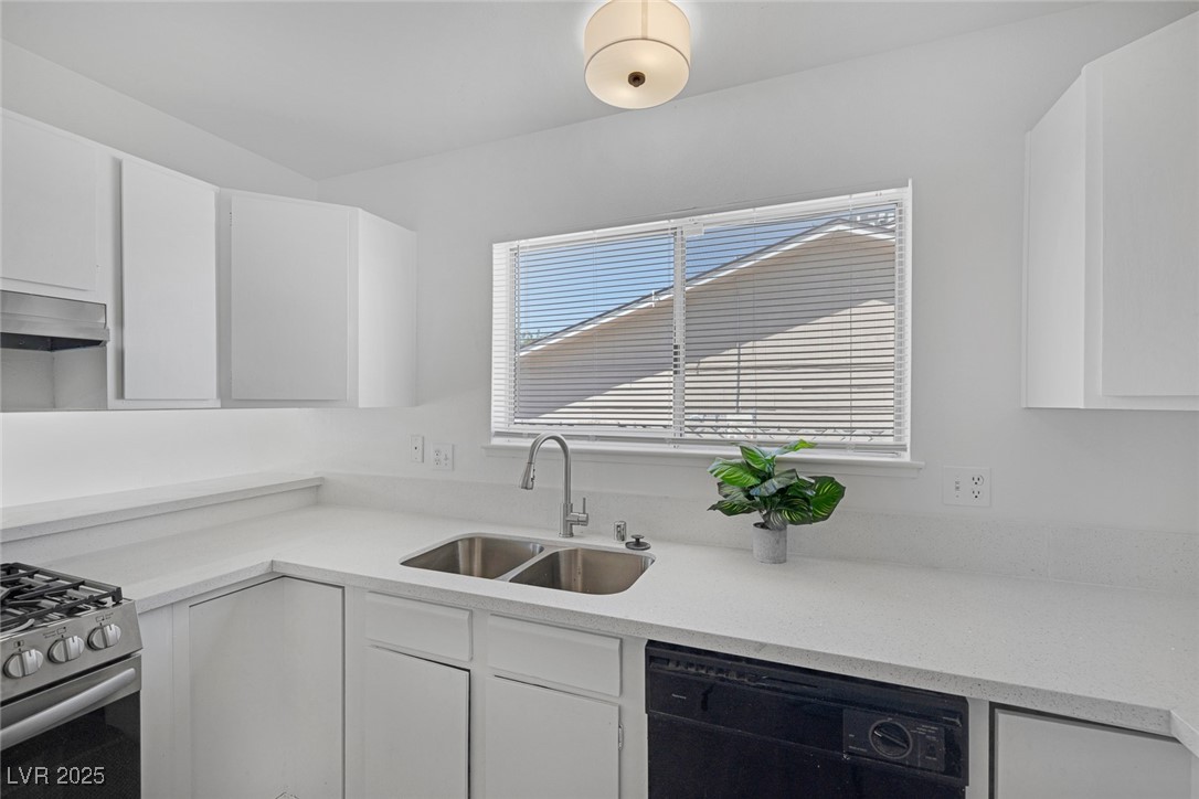 720 Sam Jonas Drive Las Vegas, NV 89145 - Photo 14 of 34 Kitchen featuring a sink, stainless steel gas rang