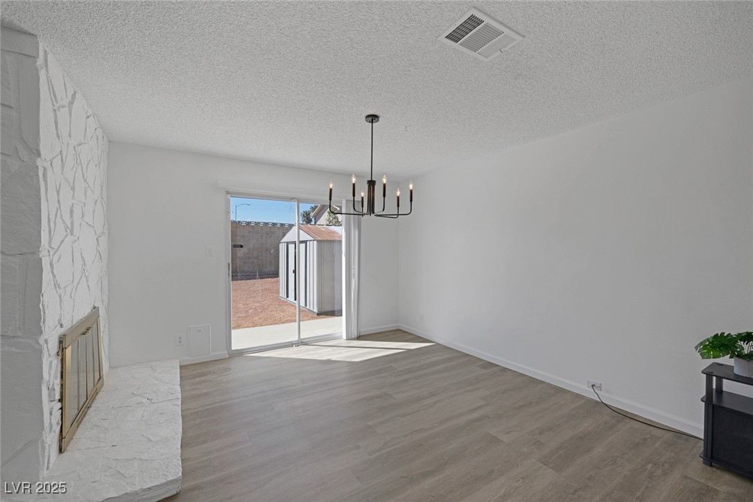 720 Sam Jonas Drive Las Vegas, NV 89145 - Photo 16 of 34 Unfurnished dining area with a notable chandelier,