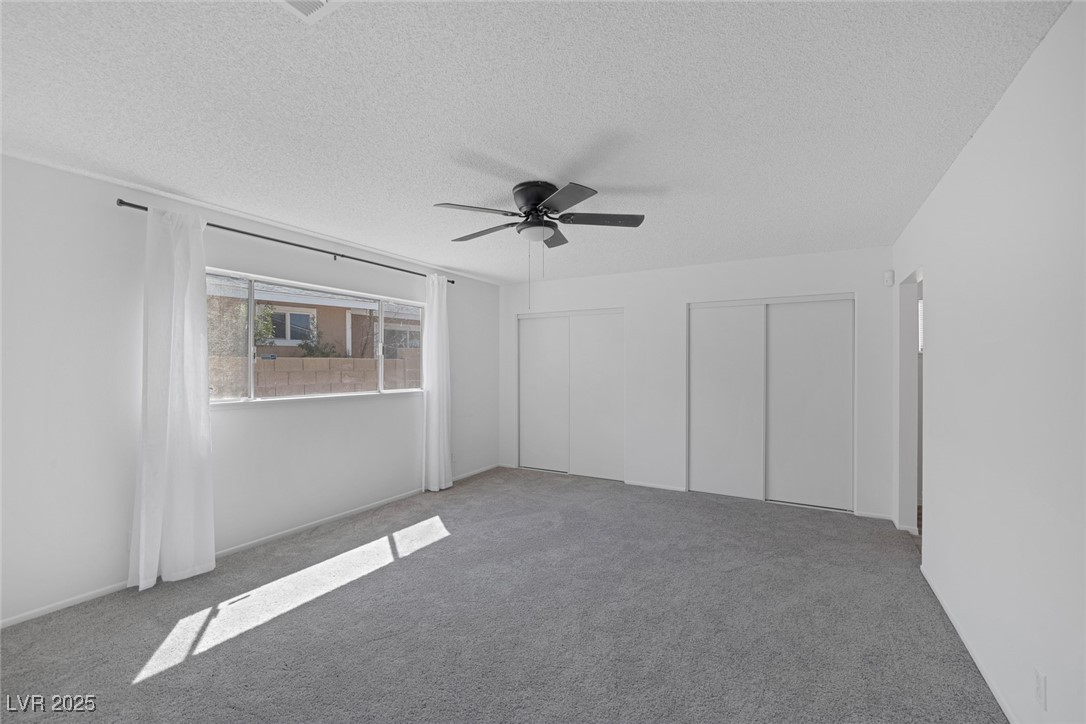 720 Sam Jonas Drive Las Vegas, NV 89145 - Photo 18 of 34 Carpeted spare room with a textured ceiling and a