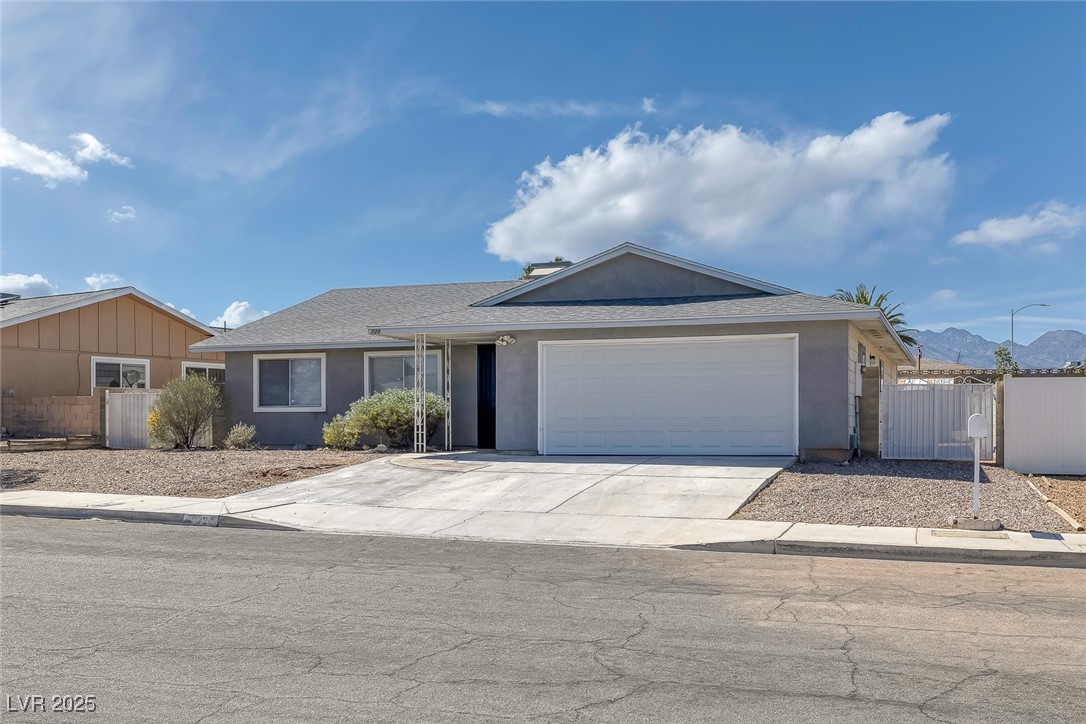 720 Sam Jonas Drive Las Vegas, NV 89145 - Photo 2 of 34 Single story home with a gate, fence, concrete dri