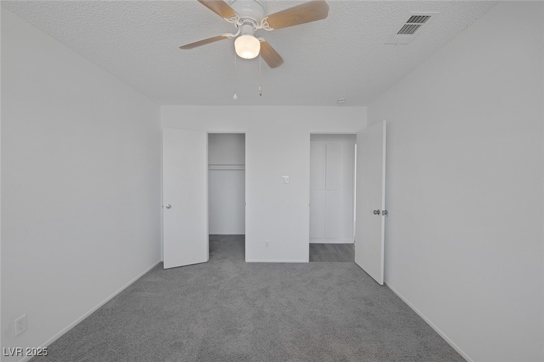 720 Sam Jonas Drive Las Vegas, NV 89145 - Photo 24 of 34 Unfurnished bedroom featuring visible vents, carpe