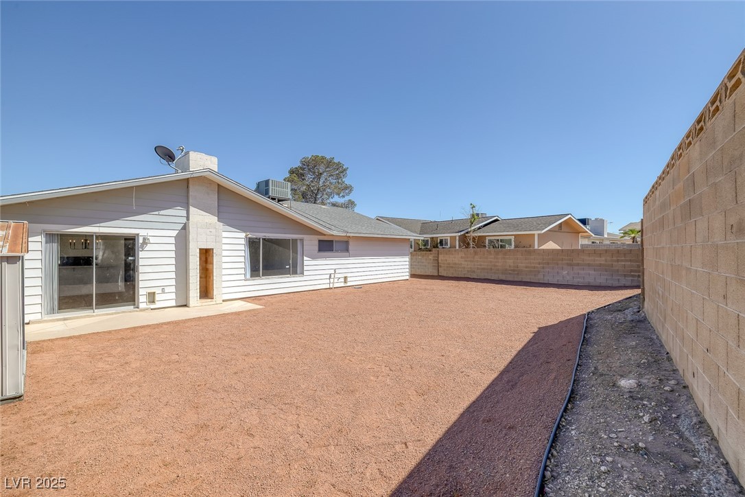 720 Sam Jonas Drive Las Vegas, NV 89145 - Photo 31 of 34 Back of property featuring a fenced backyard, a ch