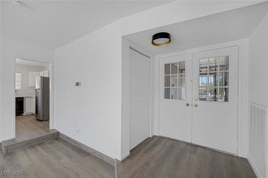 720 Sam Jonas Drive Las Vegas, NV 89145 - Photo 5 of 34 Property entrance with french doors and visible ve