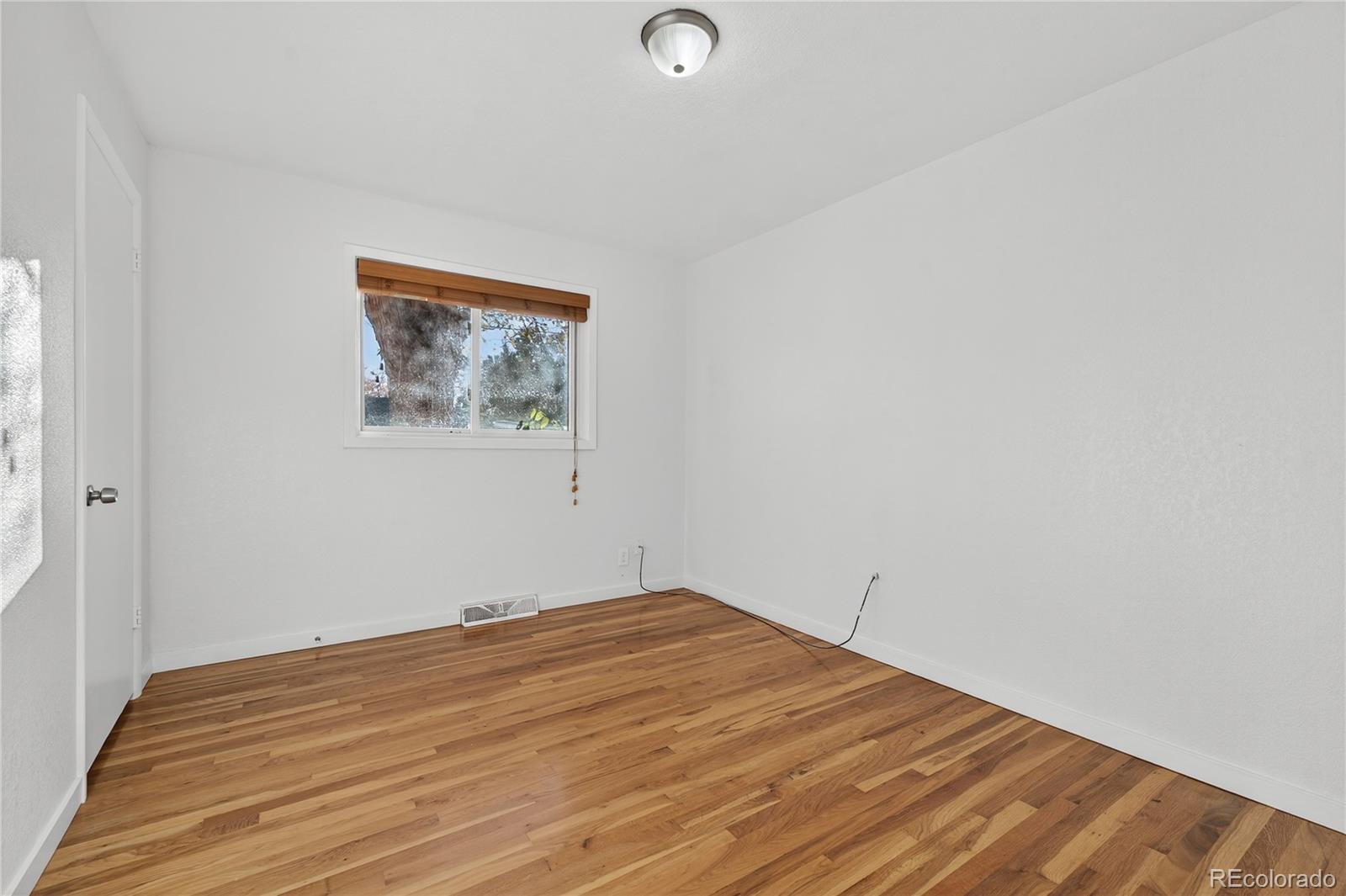 450 South 40th Street Boulder, CO 80305 - Photo 19 of 36 a view of a room with wooden floor and window