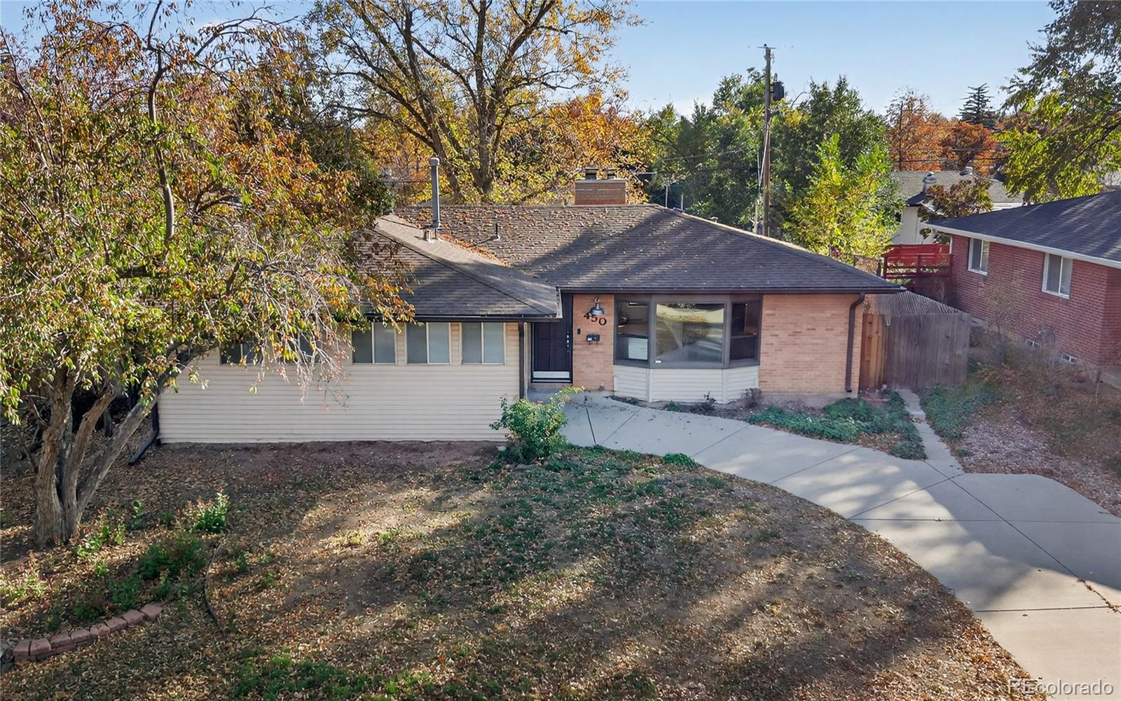450 South 40th Street Boulder, CO 80305 - Photo 31 of 36 a front view of a house with a garden