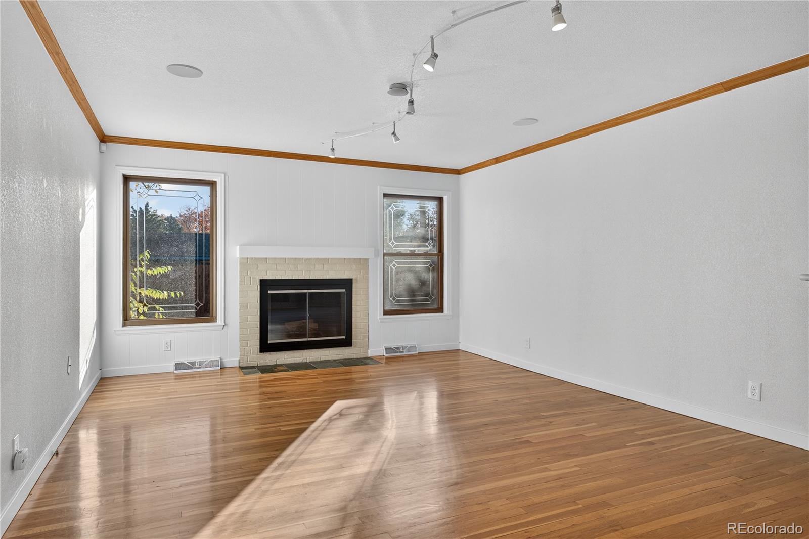 450 South 40th Street Boulder, CO 80305 - Photo 8 of 36 a view of an empty room with a fireplace and a window