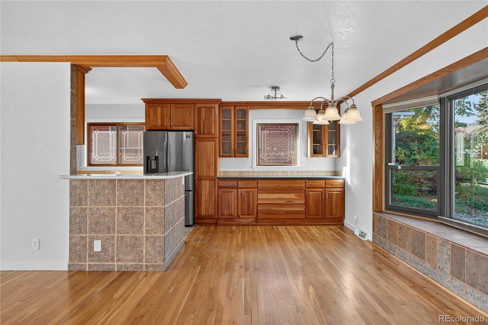 450 South 40th Street Boulder, CO 80305 - Photo 10 of 36 a view of kitchen with a window and wooden floor