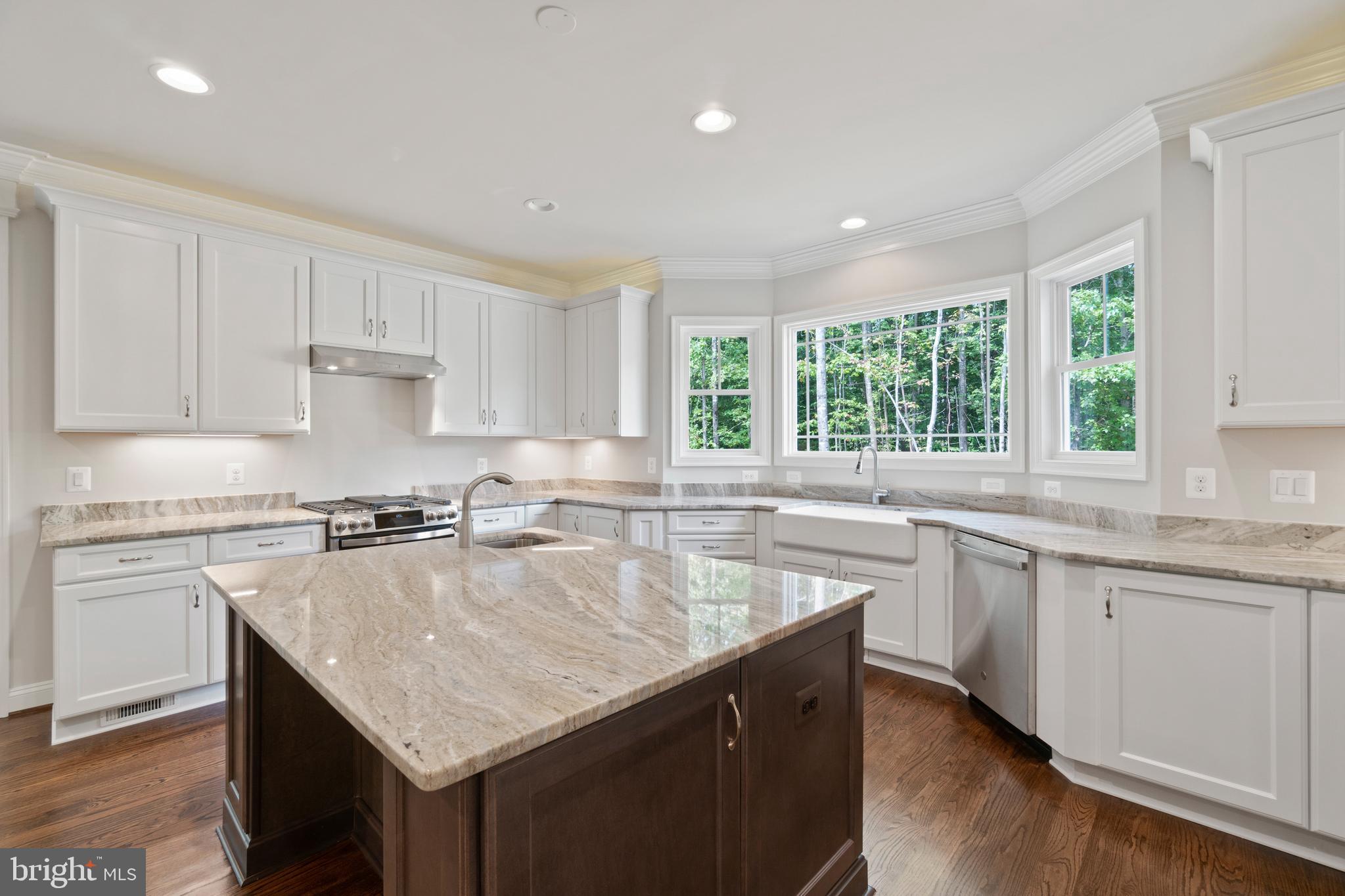 13741 Orlando Road Nokesville, VA 20181 - Photo 16 of 41 a kitchen with granite countertop kitchen island a sink counter space and appliances